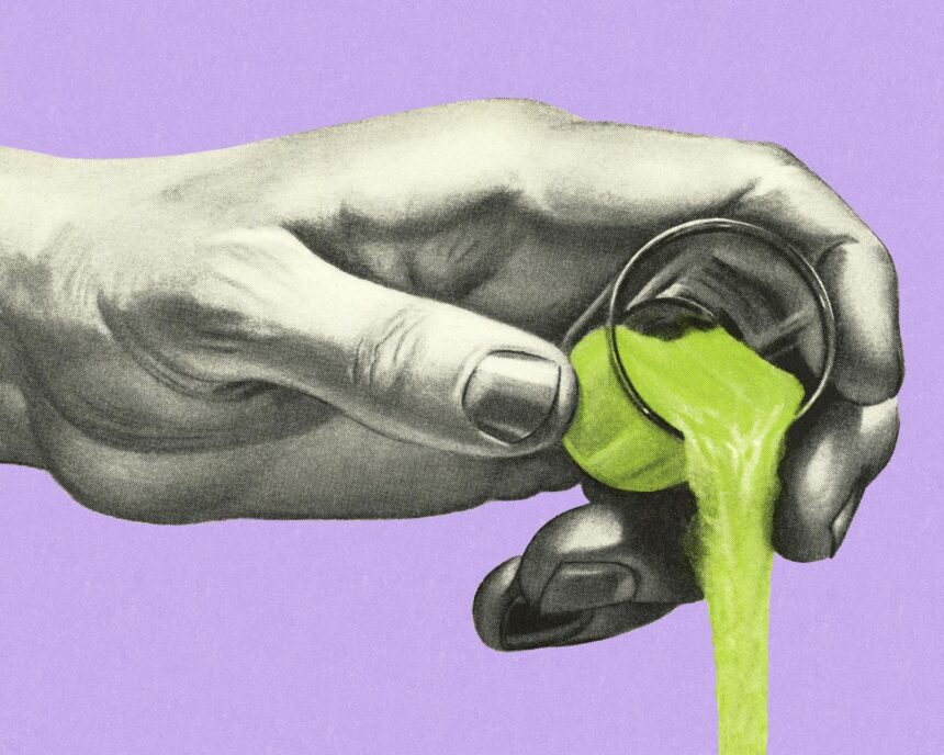 1003420280 hand pouring a green liquid