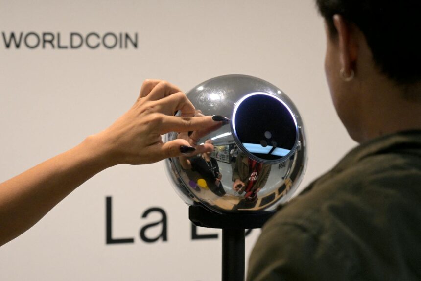 2139240312 a man has his iris scanned with an orb a biometric data scanning device in exchange for t