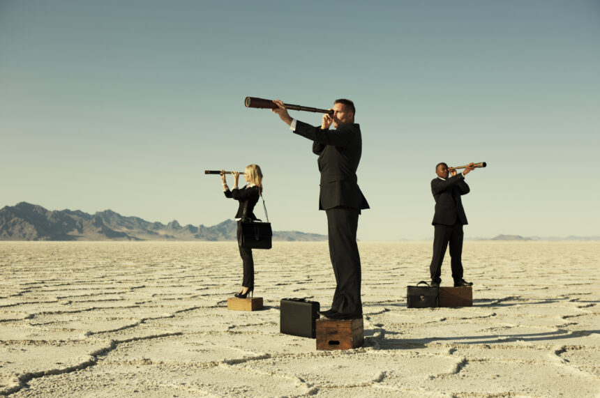 3 business people with telescopes