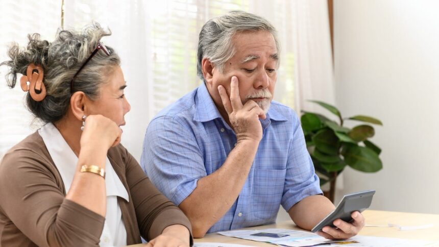 86148969007 senior couple worried about finances bills calculator social security inflation retire g