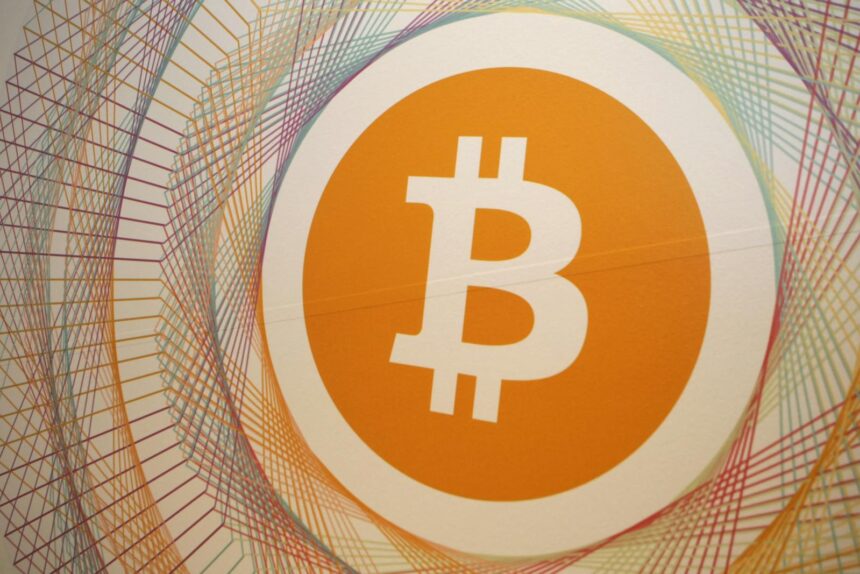 890387532 a picture shows the logo bitcoin in the first italian bitcoin crypto currency shop bitcoin