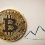 Bitcoin20token20next20to20the20upward20going20arrow id 8cfb0e03 40e0 47c5 89a6 393ee054f23c s