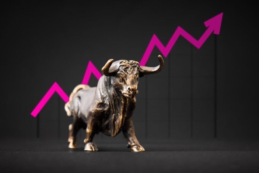 Bronze Bull Figurine In Front Of A Graph