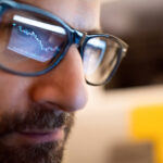 chart reflected on investor glasses