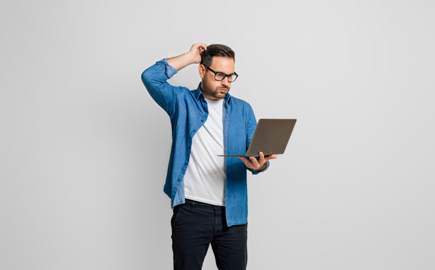 confused investor with laptop