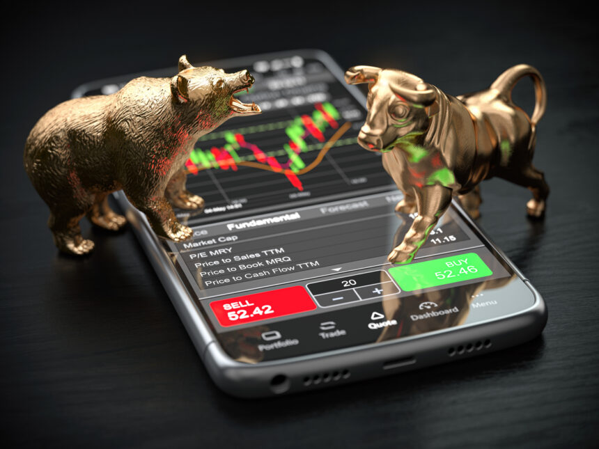 gettyimages bull bear phone buy sell stock chart