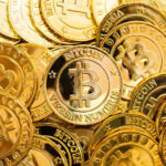 gold coins with bitcoin logo on them