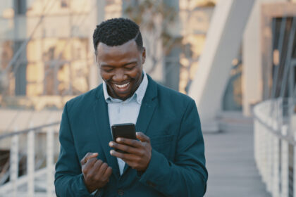 smiling at smartphone 1419726675