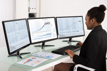 trader investor screens chart graph stocks finance