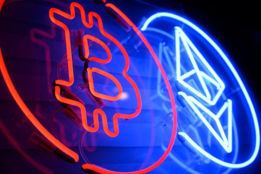 2191923651 a neon sign advertises a bitcoin and ethereum crypto currency exchange in warsaw poland o