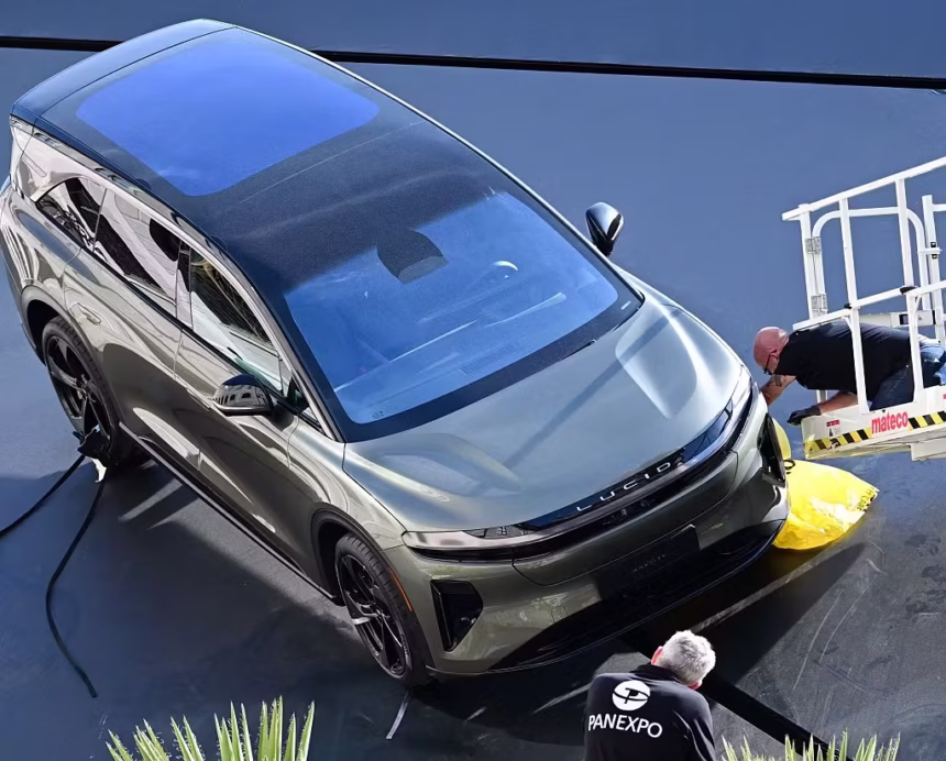 Lucid Teams Up with Nvidia for Level 4 Autonomous Driving in Future SUVs 1 2233558655 a worker inspects a lucid gravity grand touring car on the roof of the lucid companys boo