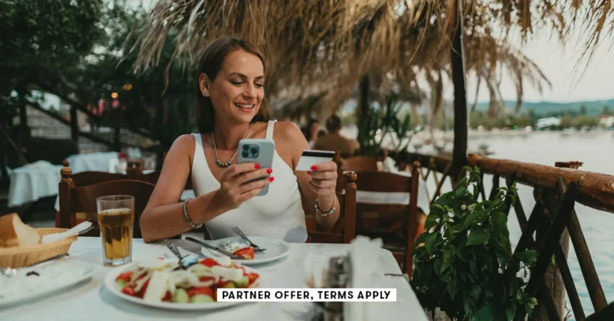 SOCIAL IMAGE PARTNER OFFERS TERMS APPLY Woman using a smartphone and paying with a credit card in a