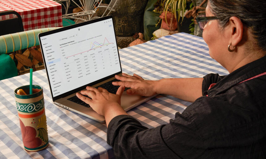 person using square block platform for business on laptop block