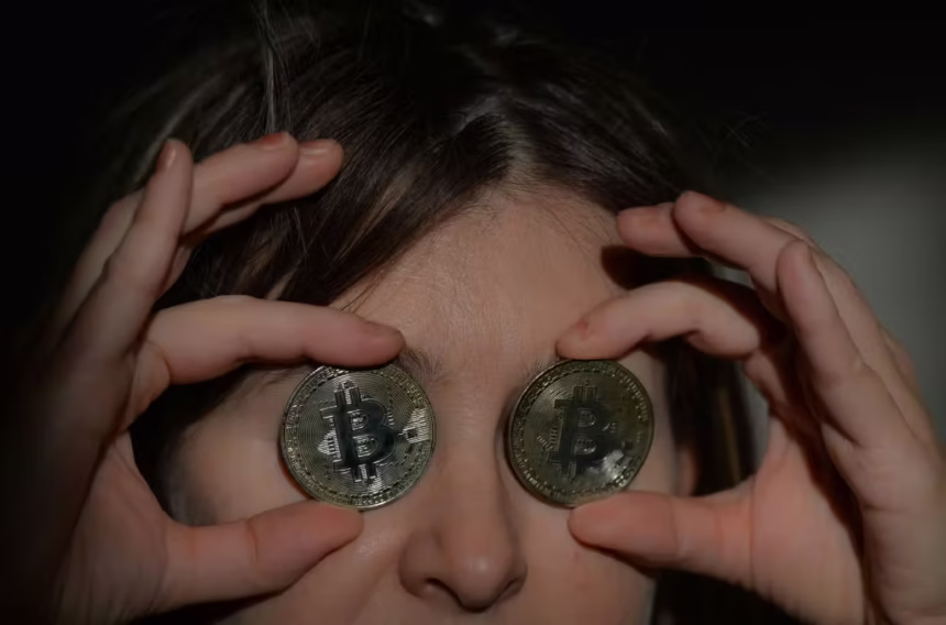 1237692309 in this photo illustration a nitizen holds two commemorative bitcoins on wednesday januar