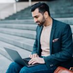 urlhttps3A2F2Fg.foolcdn.com2Feditorial2Fimages2F8572922Fbusiness trader laptop smiling