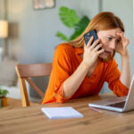 woman laptop phone getty