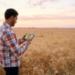 Farmer20holds20tablet20using20online20data20management20by20artiemedvedev20via20iStock