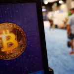 1239847346 miami florida a bitcoin logo is seen during the bitcoin 2022 conference at miami beach.jp