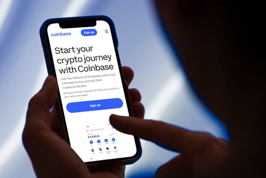 Coinbase Launches AI Tool for Autonomous Trading Amidst Stock Struggles 1 The20Coinbase20website20on20a20mobile20phone20by20PhotoGranary20via20Adobe20Stock